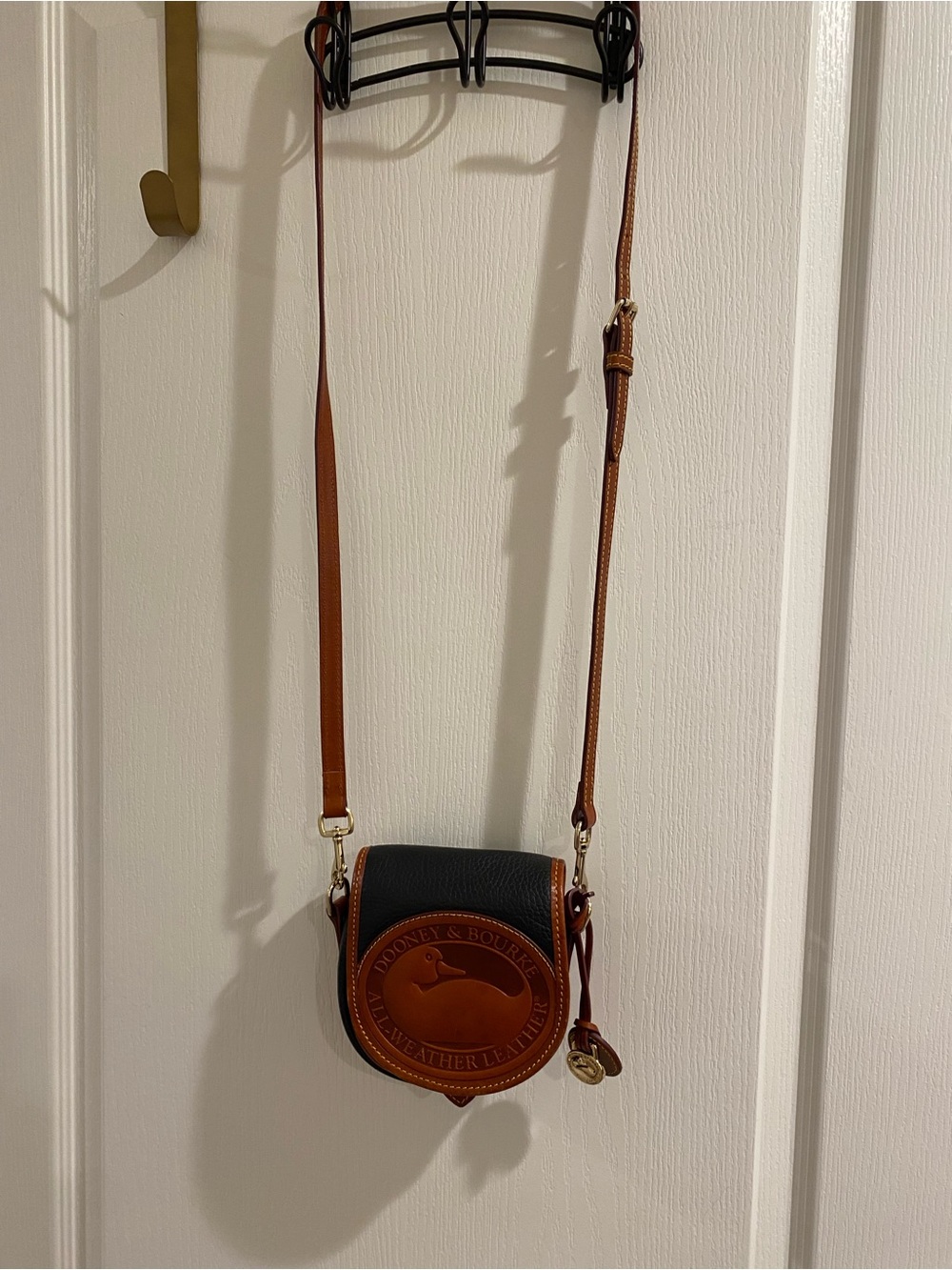 Dooney & Bourke Black and Brown Leather Mini Crossbody in like-new-condition